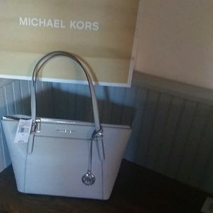 Michael kohrs large leather TZ tote.